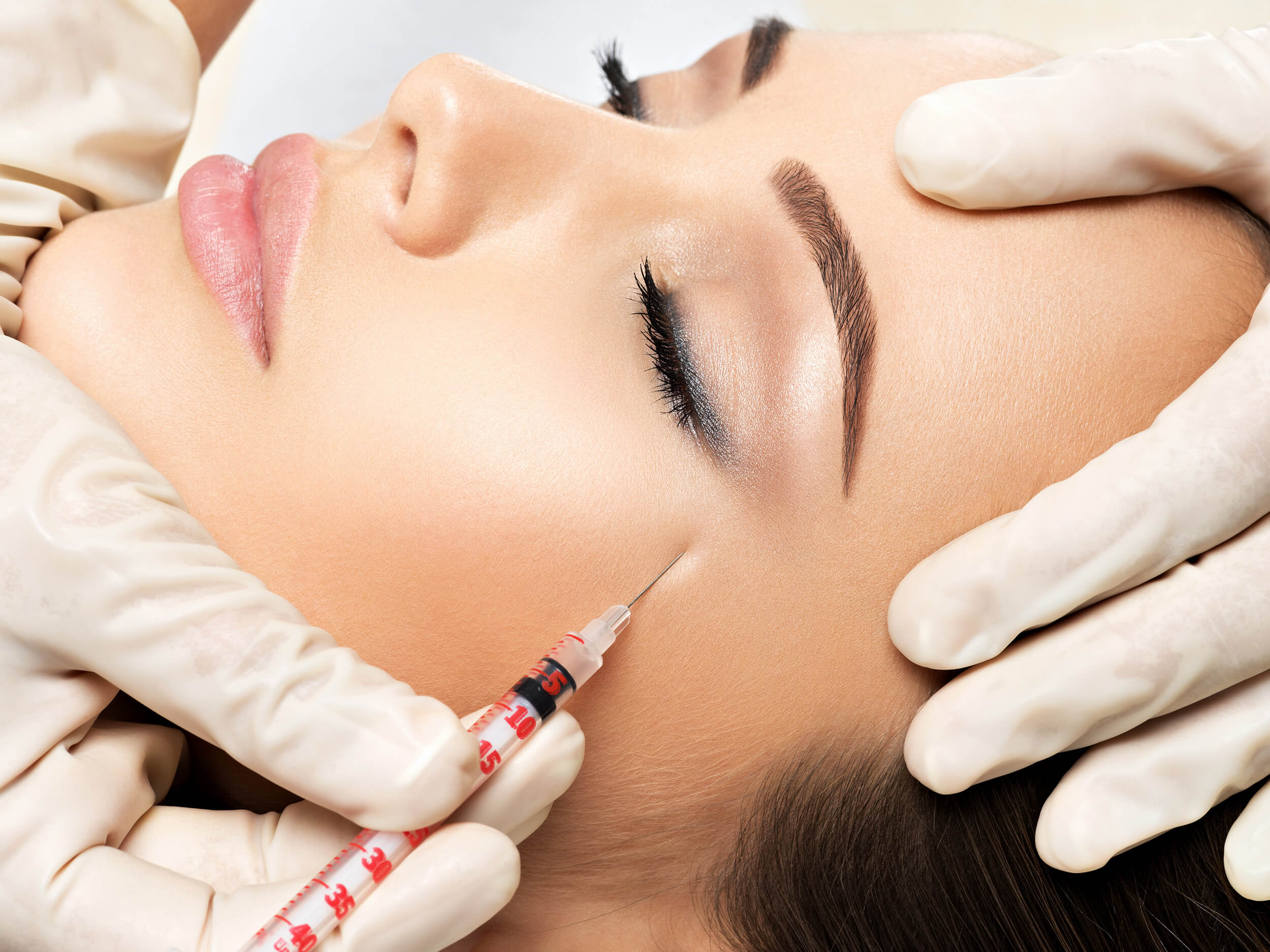 woman-getting-cosmetic-injection-of-botox-near-eye-2023-11-27-04-57-51-utc